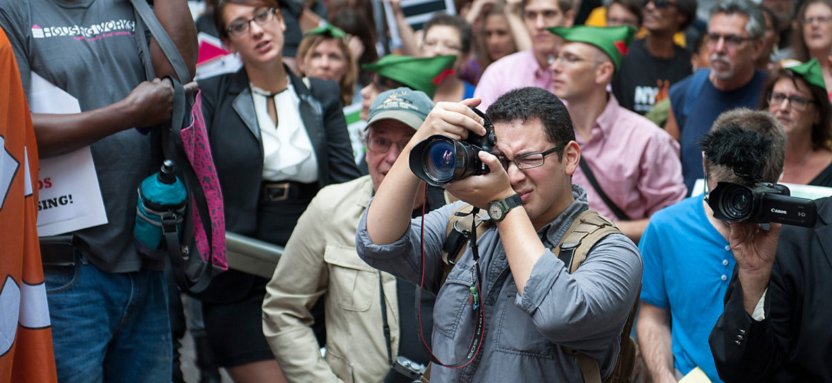Stony Brook University School of Journalism student Kevin Lizarazo shoots Occupy Wall Street's 1 year anniversary at Manhattan's Zuccotti Park on Sept. 17, 2012.