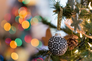 An ornament on a Christmas tree shot at an 85 mm-equivalent focal length at f/1.2.